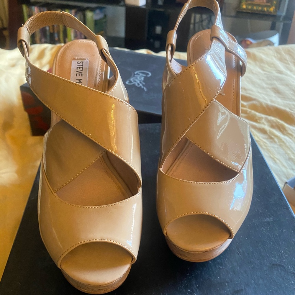 Tan patent leather crisscross wedge sandals